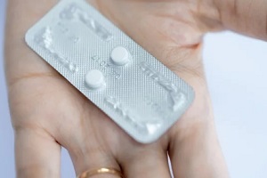 NC women holding birth control pills