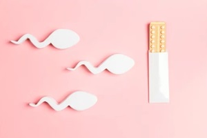female oral contraceptive pills blister in the way of sperm movement on pink background