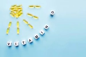yellow capsules in the form of the sun with rays and the word vitamin D
