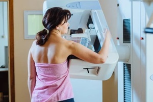 female patient undergoing mammography test in hospital