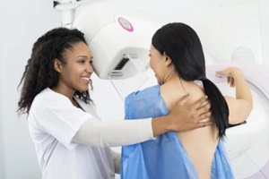 Raleigh obgyn assisting woman undergoing mammogram x-ray test