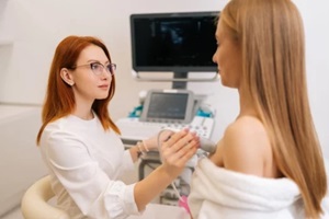 Raleigh, NC woman getting breast examination during appointment at hospital