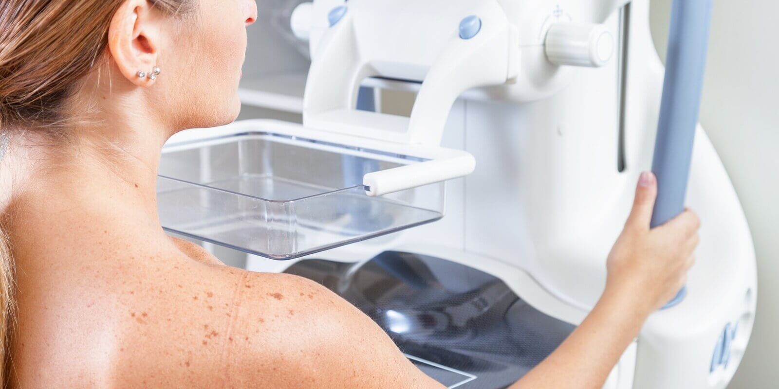 woman undergoing medical mammography scan in Raleigh obgyn