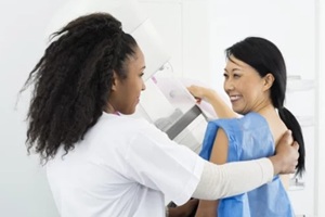 asian women getting mammography done with a Raleigh OBGYN nurse