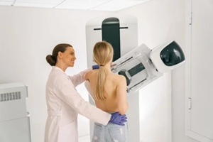 woman doing mammogram x ray for breast cancer prevention screening at hospital