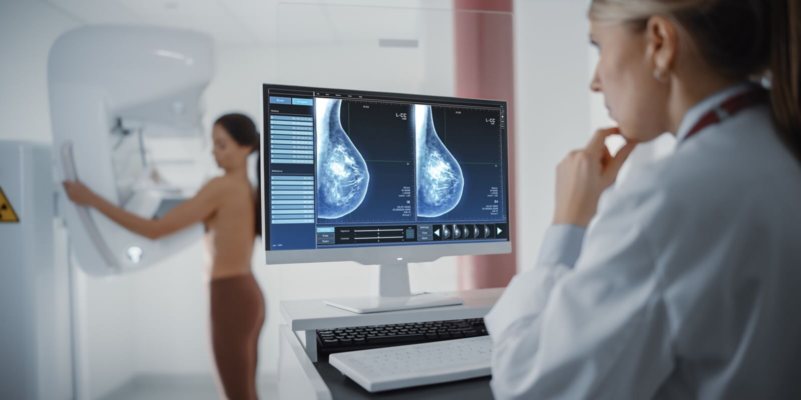 Raleigh, NC woman standing topless undergoing mammography screening procedure