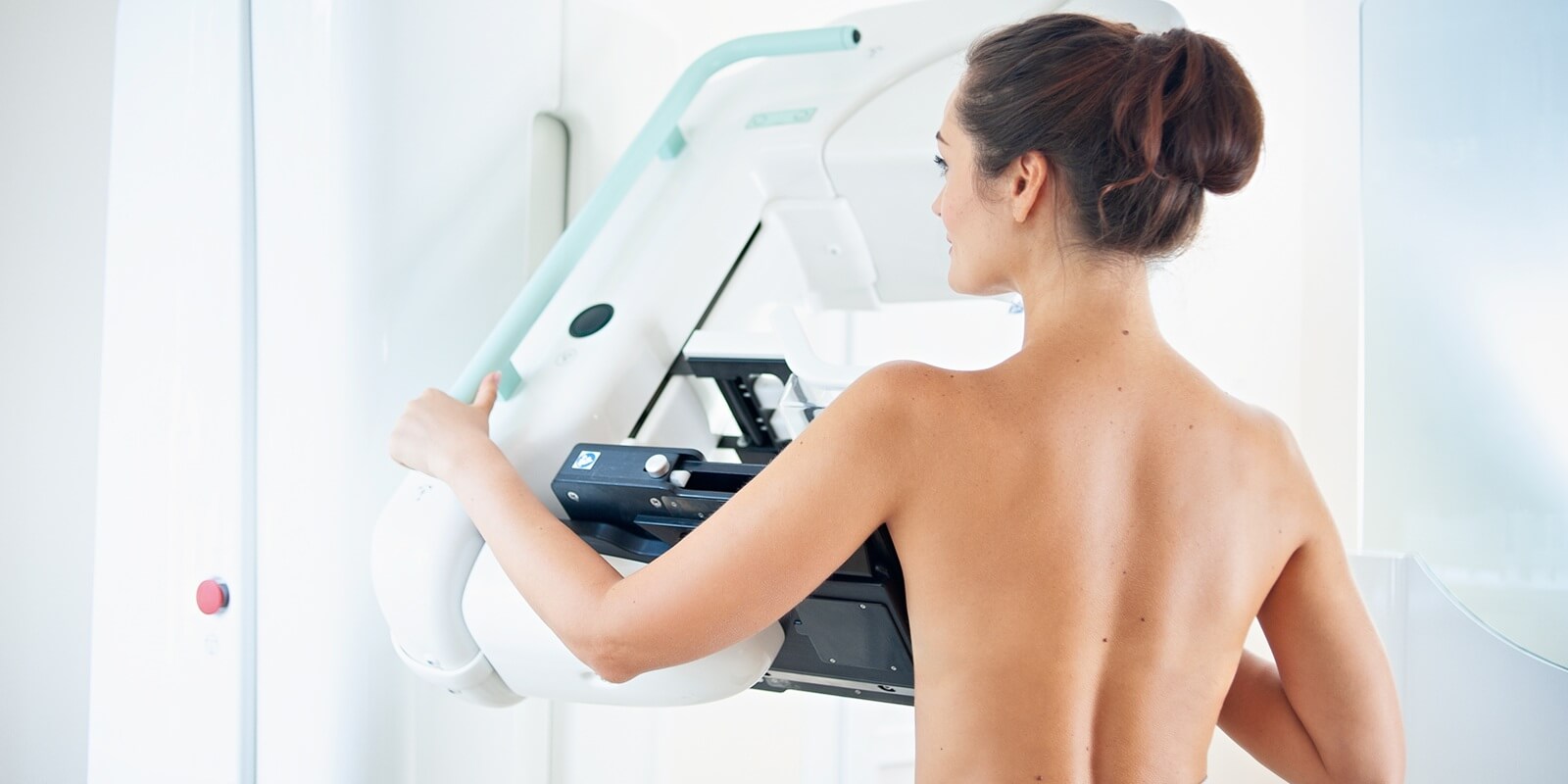 healthy young woman doing cancer prophylactic mammography scan at Raleigh, NC hospital