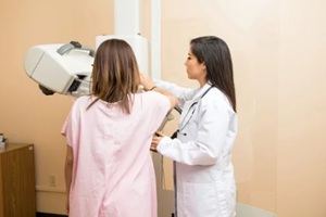 doctor and patient during mammogram study in a hospital