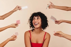 women looking at various birth control options