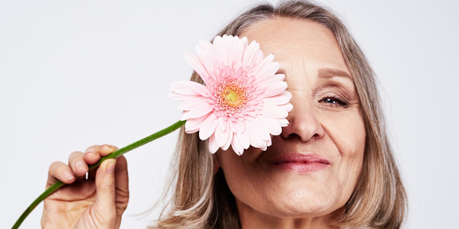 Raleigh, NC woman with menopause holding flower