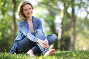 women in denim dress sitting in the park