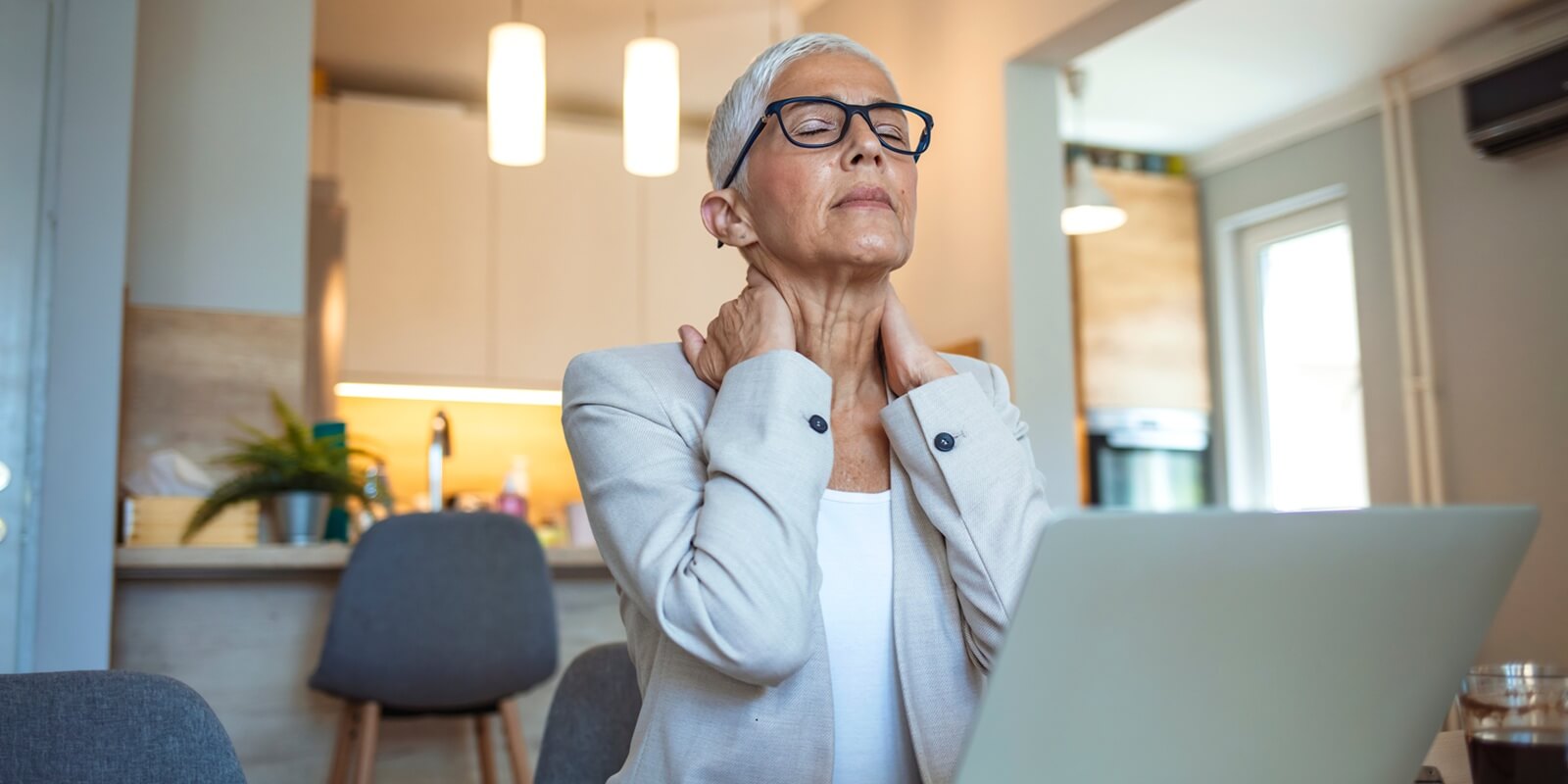 shot of a mature businesswoman experiencing menopause symptoms