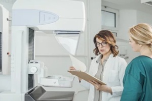 doctor and patient on mammography examination