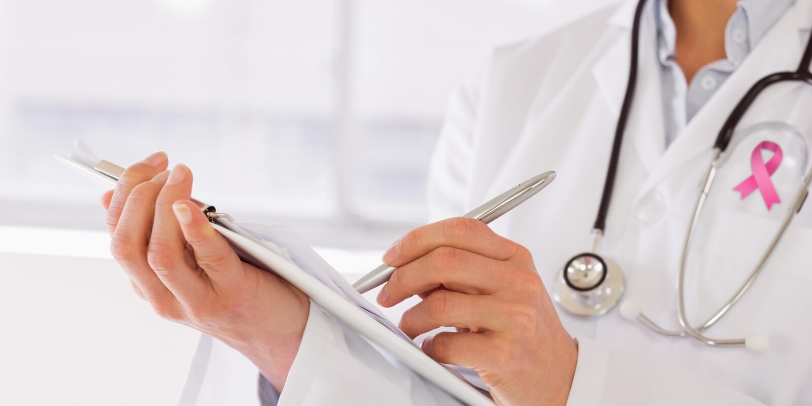 composite image of mid section of a female doctor writing - bi rads mammogram results