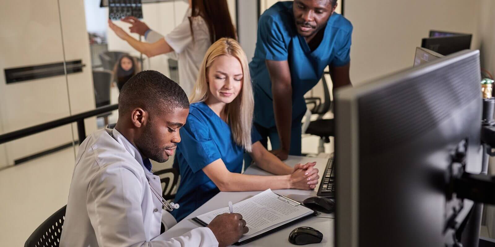 professor doctors discussing studying Mammogram film x-ray of patient 's head for brain