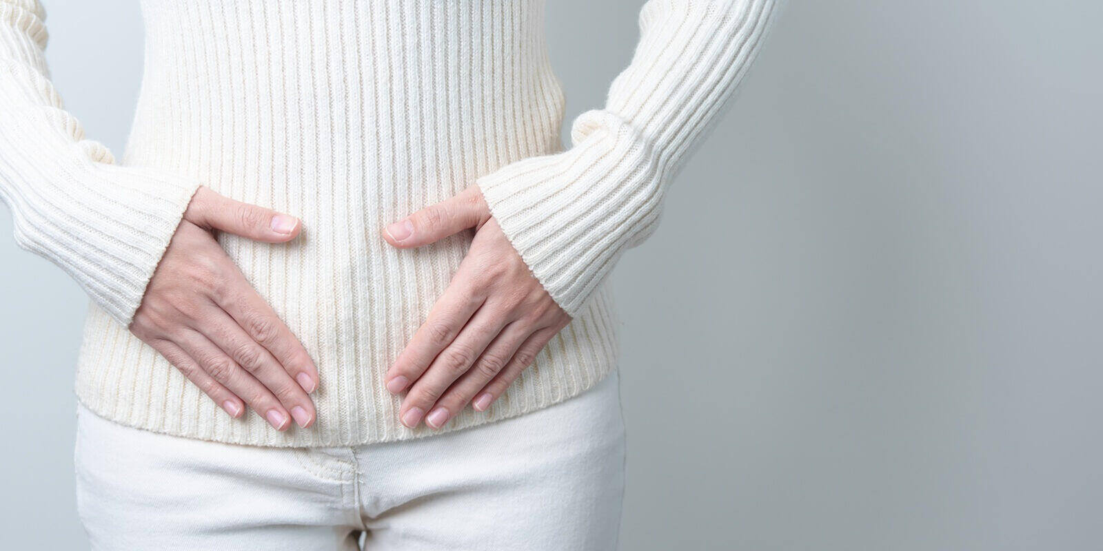 woman holding her belly